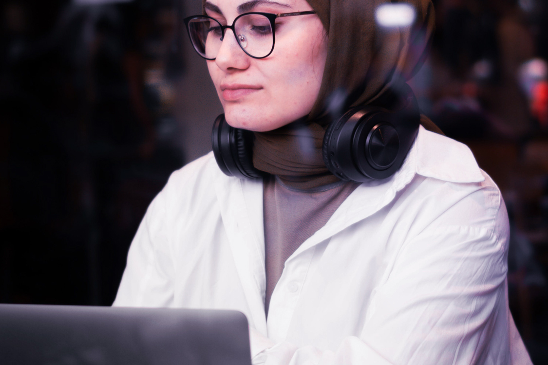 Image of a woman working on a laptop