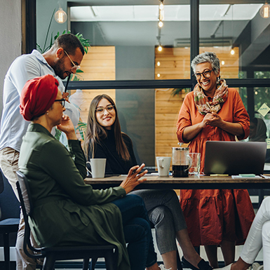 Image of people conversing over coffee