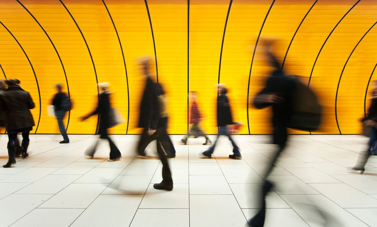 blurred and defocused people walking